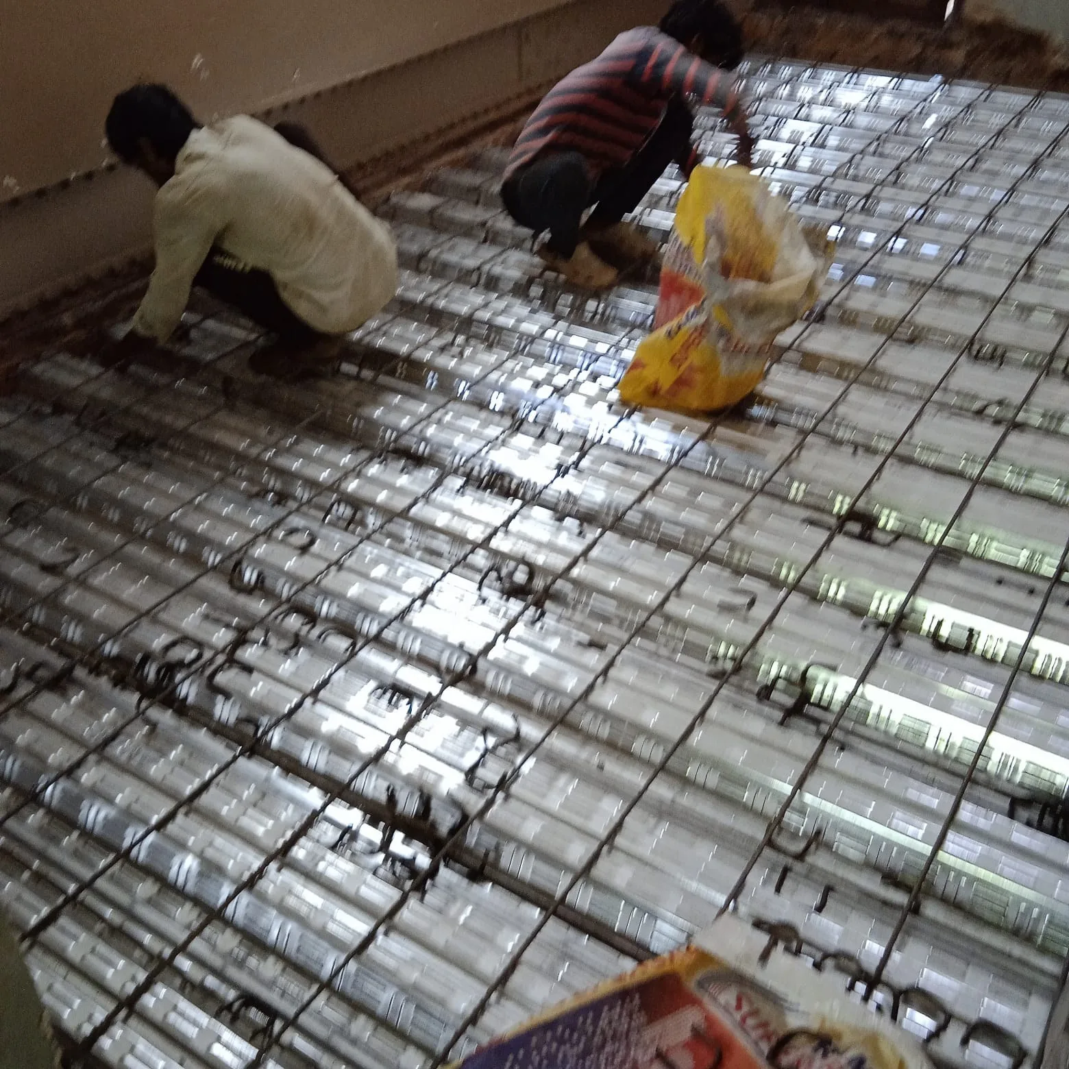 Workers carrying out repair work on the monastery roof